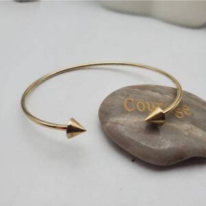 Horned double arrow gold tone tribal bracelet‎